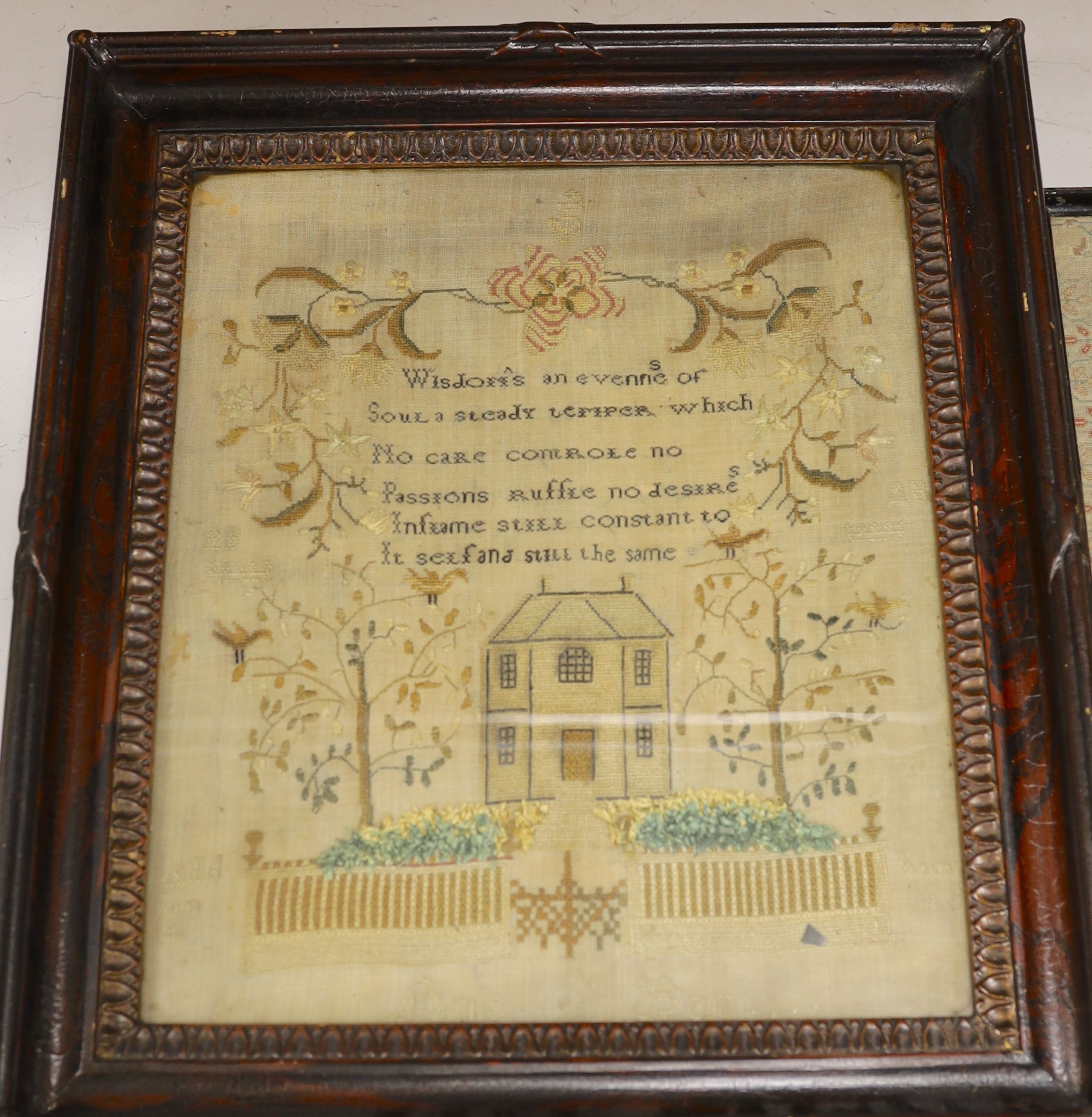 A George III finely embroidered Lords Prayer with angelic figure, flowers and text, 31 x 22cm, together with a later sampler, embroidered with house and trees, 35 x 29.5cm, both framed.